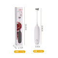 Black and white hand-held electric milk frother blender for coffee preparation