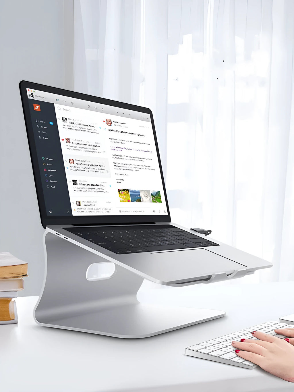 Aluminium alloy rotary laptop cooling bracket in grey and silver, showing adjustable angle and open-frame design.