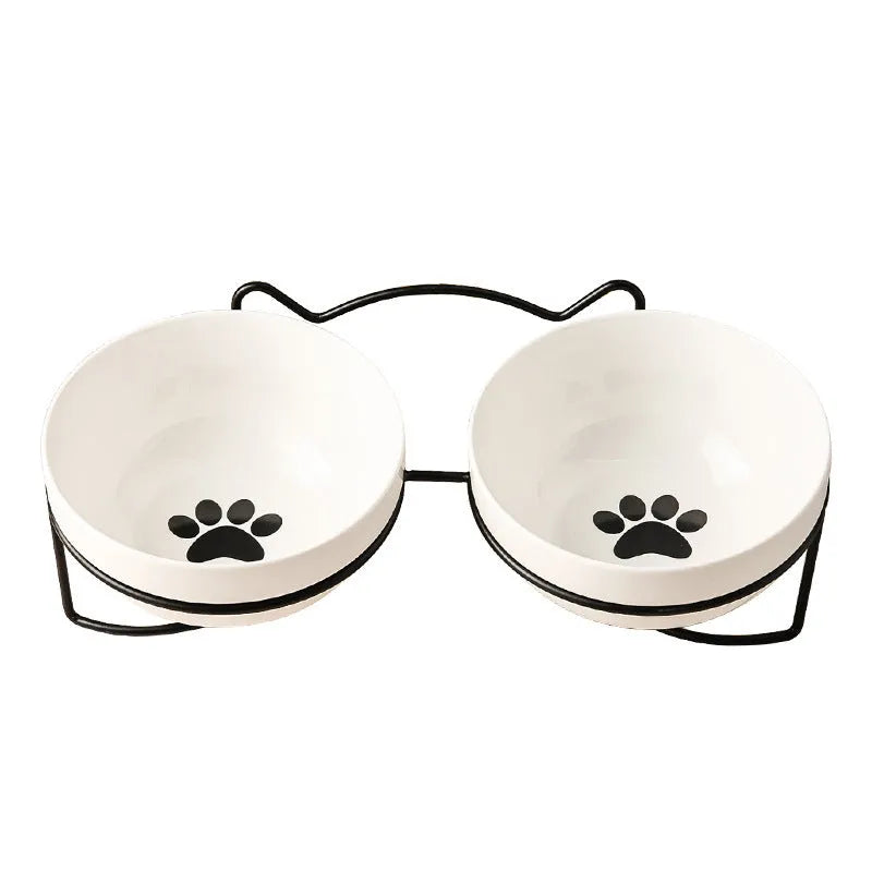 White ceramic cat bowl with iron frame in cat footprints design