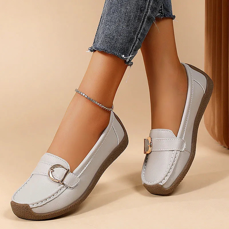 Women's beige casual loafers with a round toe and flat soft sole.