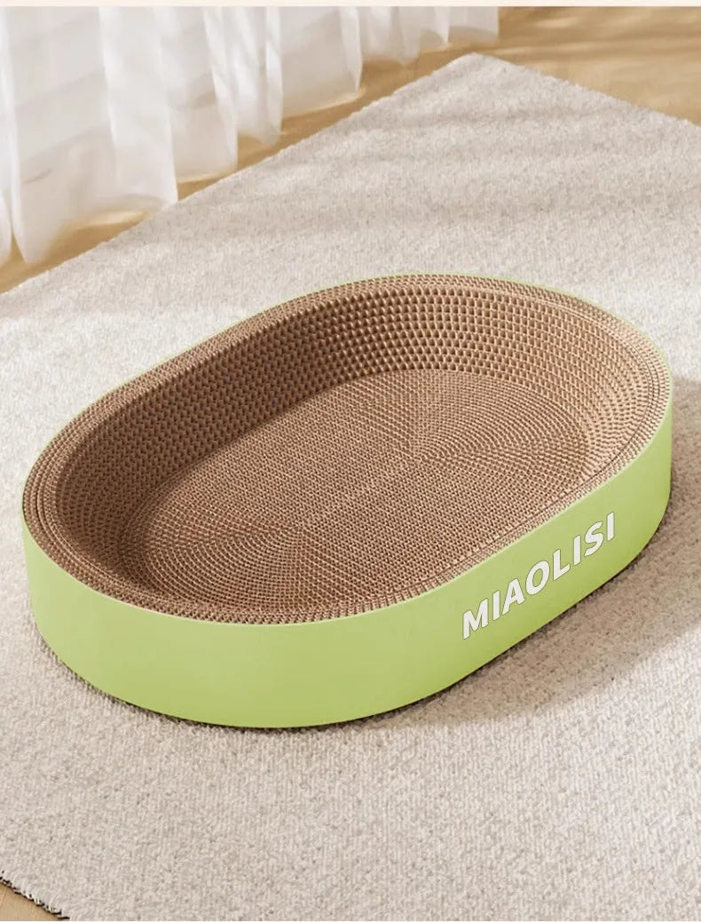 Green oval corrugated paper cat scratch board and nest measuring 55cm in diameter