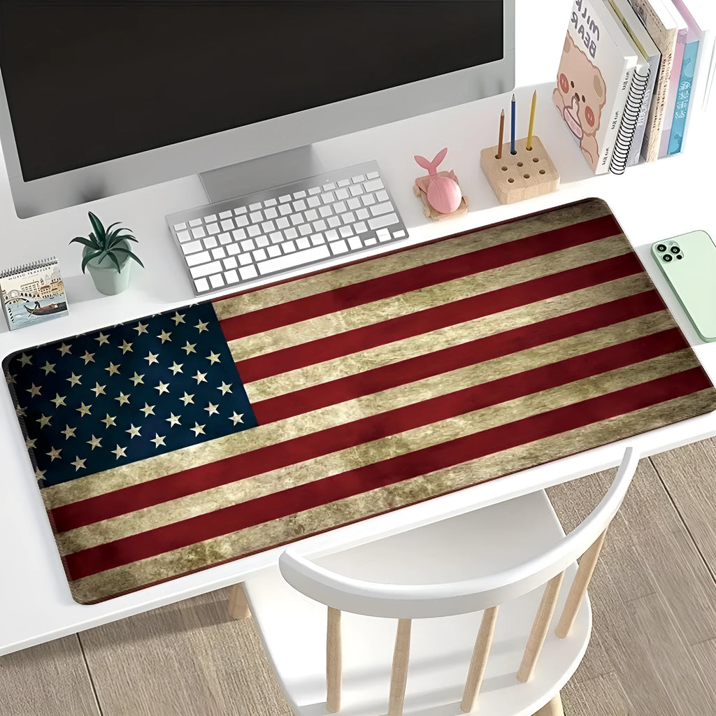 Large desk pad mouse mat with patterned design and non-slip natural rubber base on a wooden desk.