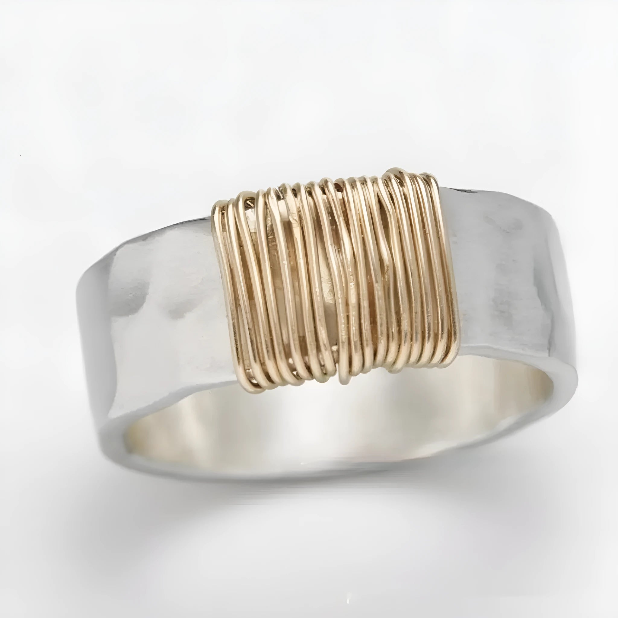 Copper bracelet ring with geometric coil design in silver gold colour on wrist