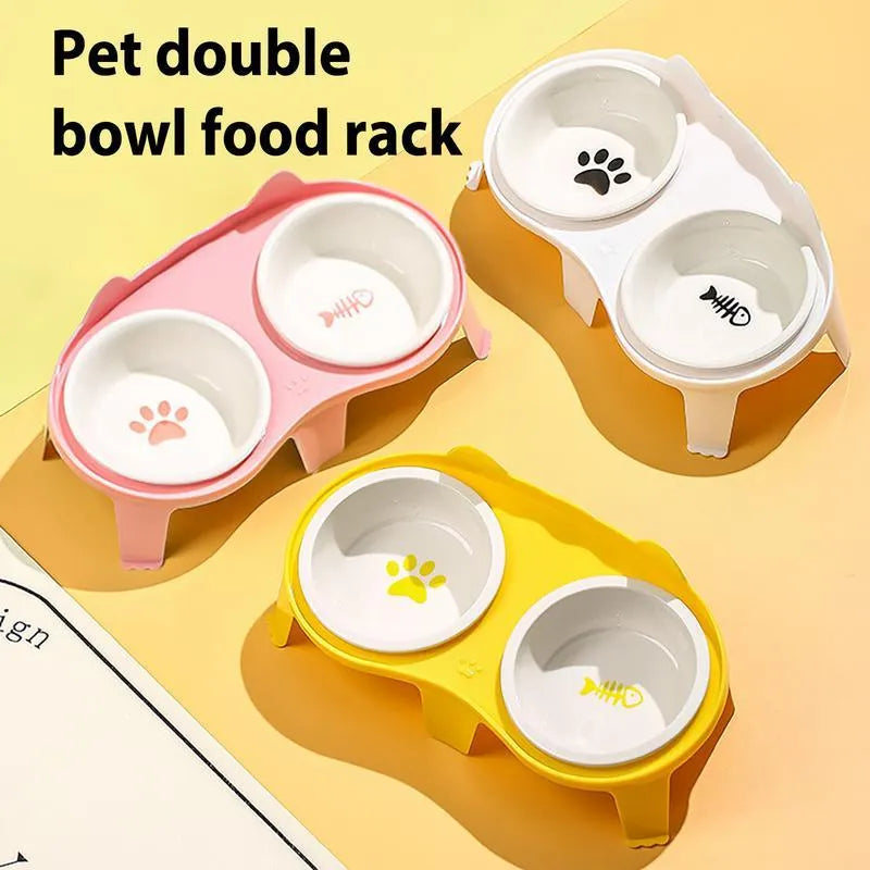 Blue ceramic cat bowl set on white elevated stand with hook, showing tilted food and water dishes.