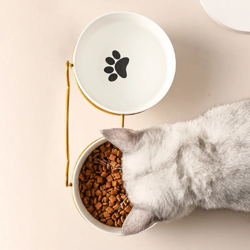 White ceramic cat bowl with iron frame in cat footprints design