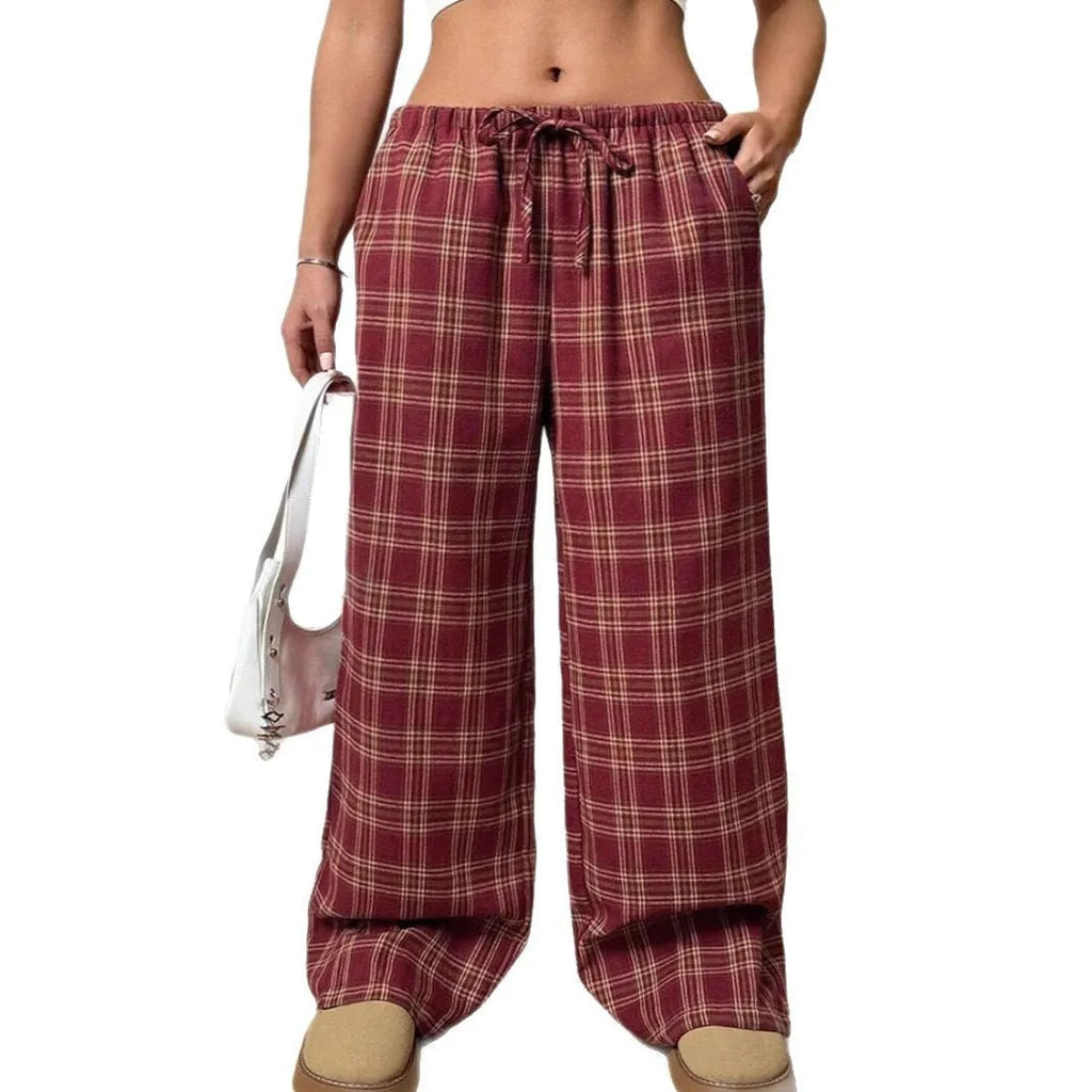 Women's loose fit plaid trousers with drawstring waist and patch pockets in casual styling