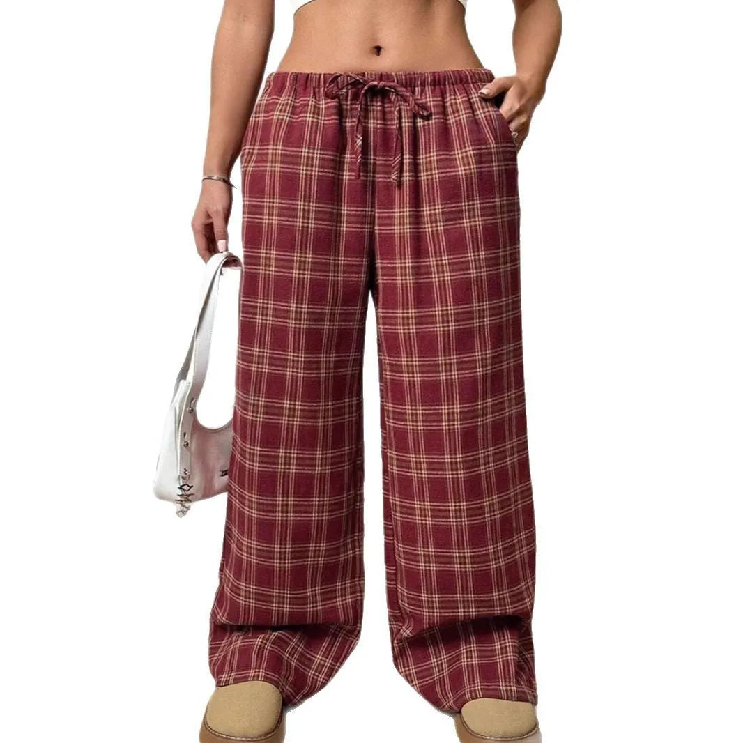 Women's loose fit plaid trousers with drawstring waist and patch pockets in casual styling