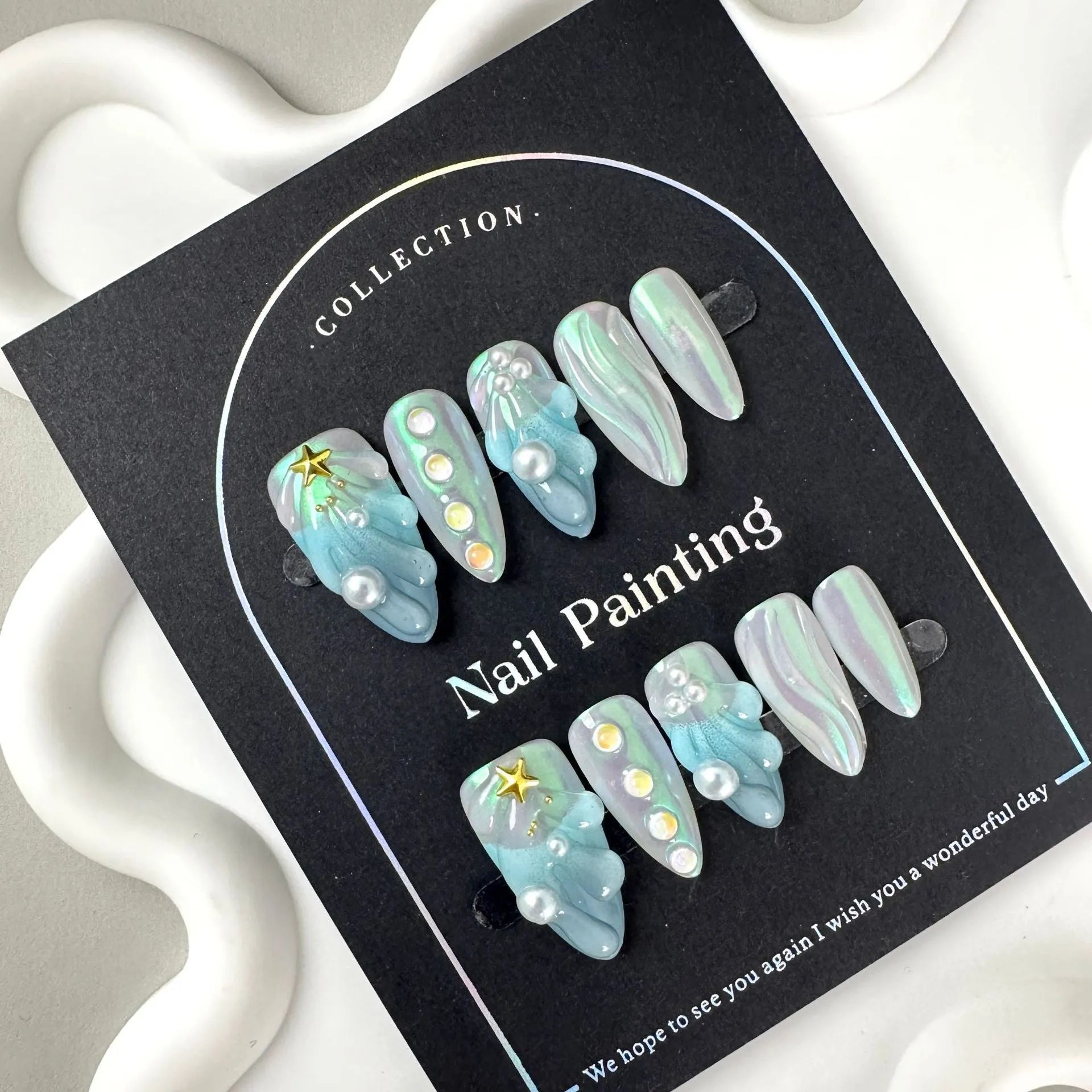 HAILANG blue plastic artificial nail tips set showing sizes XS, S, M, L for French manicure.