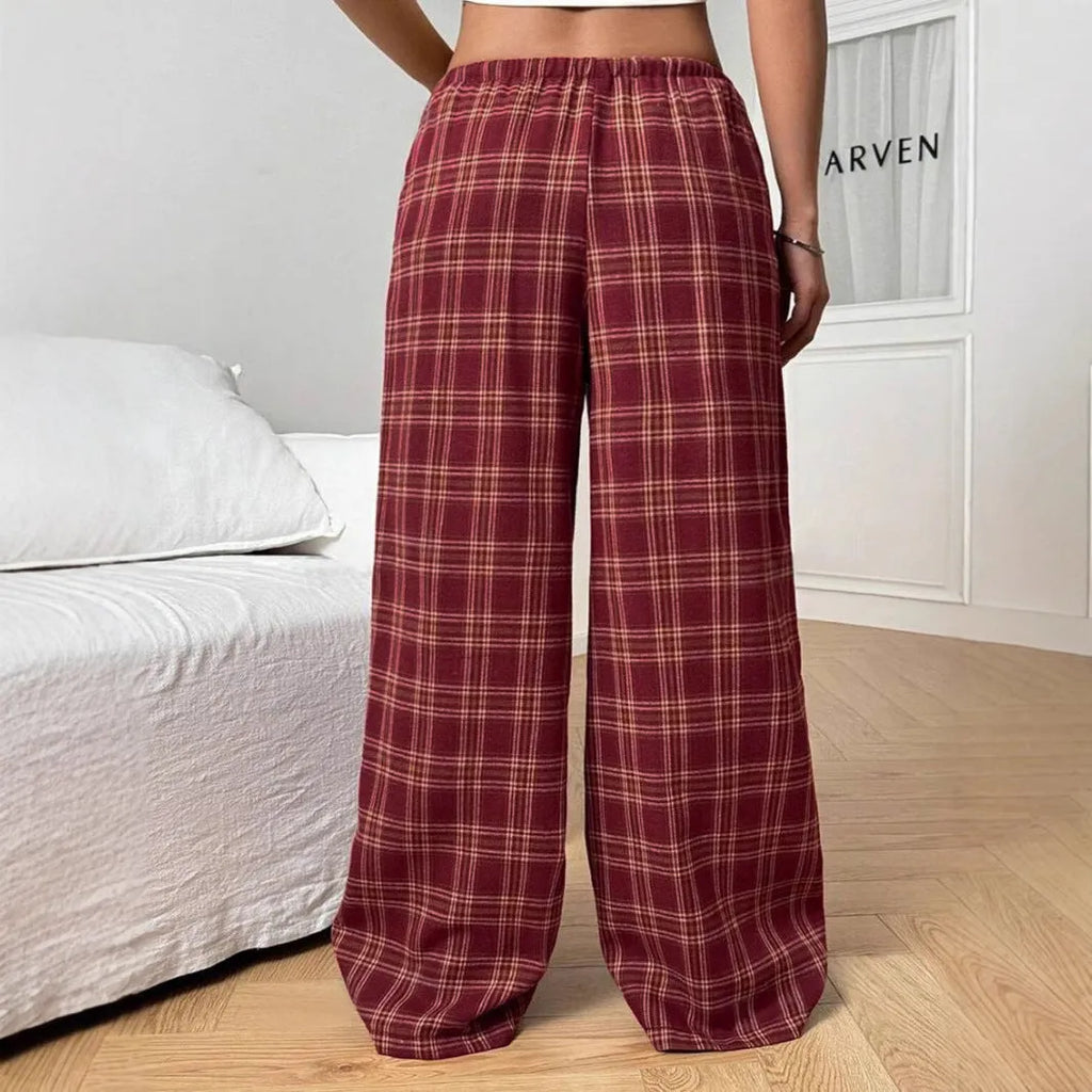 Women's loose fit plaid trousers with drawstring waist and patch pockets in casual styling