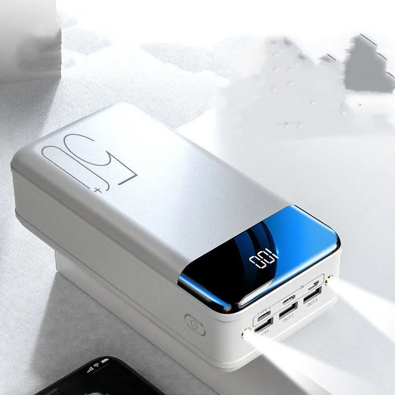Black and white 50000mAh power bank showing three output USB ports and three input charging ports