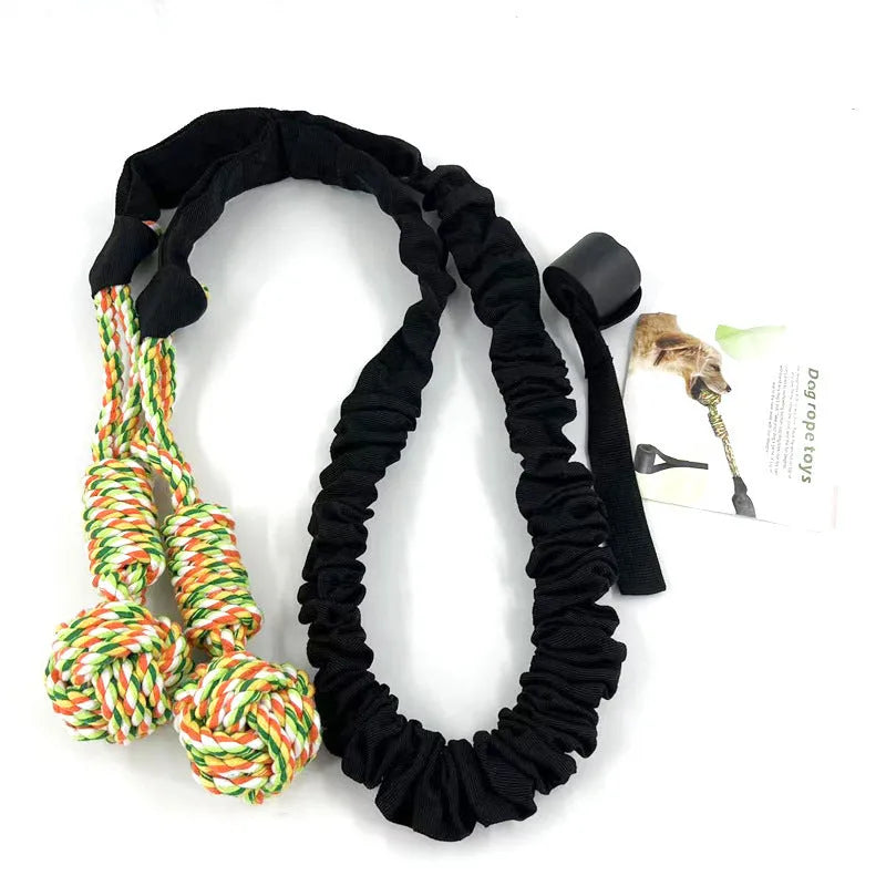 A black, grey, and red cotton rope dog tug toy for chewing and interactive play.