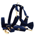 Navy blue corduroy dog collar leash set with bow, vest, and poop bag on white background