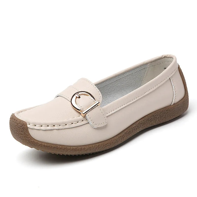 Women's beige casual loafers with a round toe and flat soft sole.