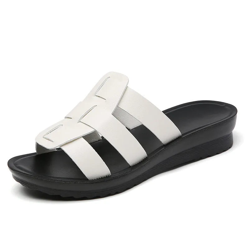 Beige flat-bottom women's slippers with viscose upper and PU sole, shown in a large size.