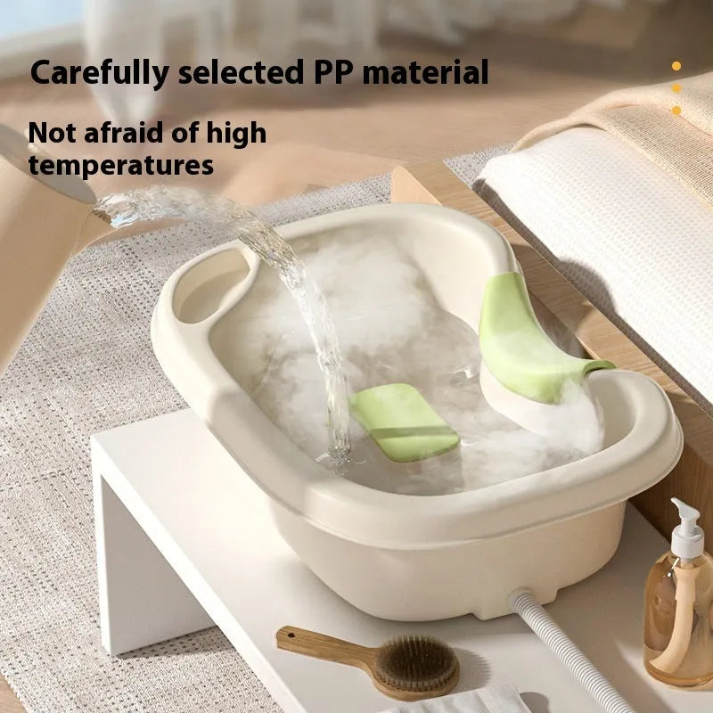 Light pink plastic shampoo basin for bed use with head pad, neck pillow, and water pump on bed