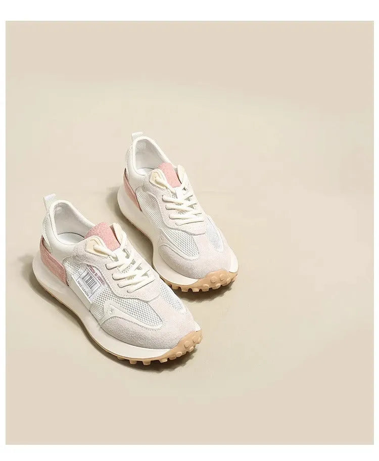 Women's grey and pink low-top retro sneakers with a round toe and flat rubber sole.