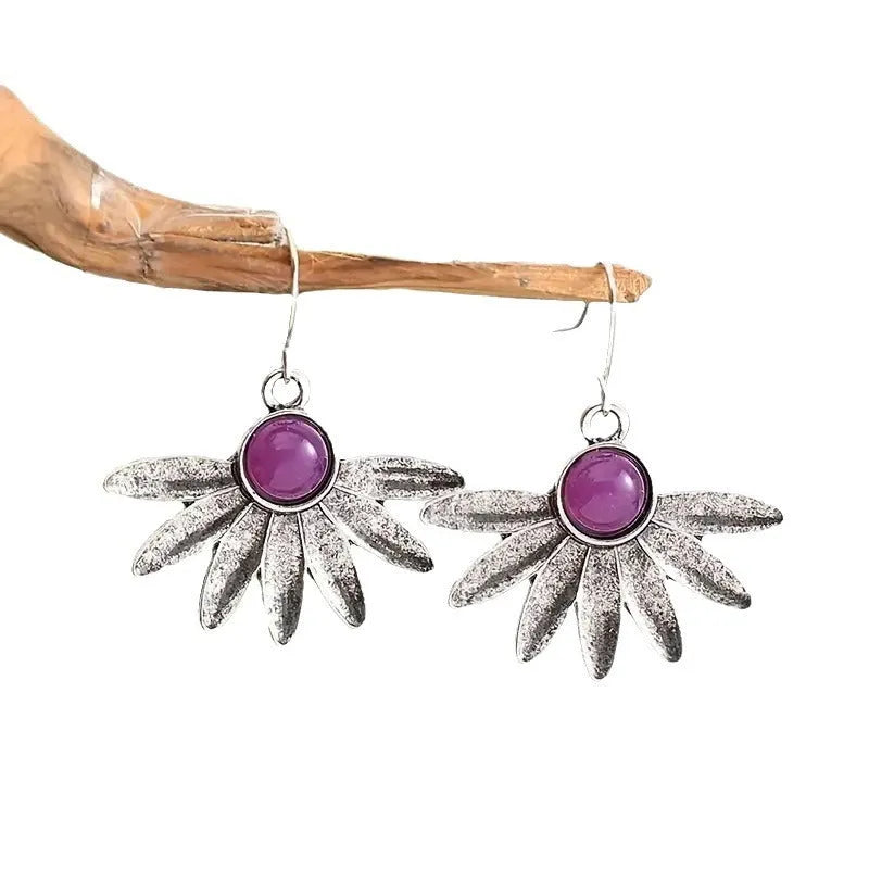 Purple resin bohemian style earrings with floral design and animal zodiac modelling