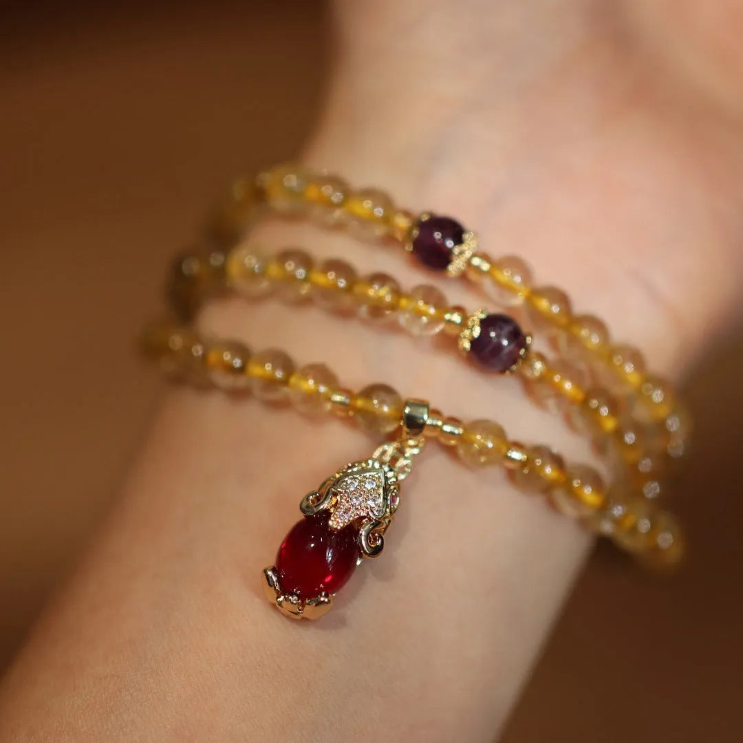 Natural gold rutilated quartz bracelet with hanging chopsticks design