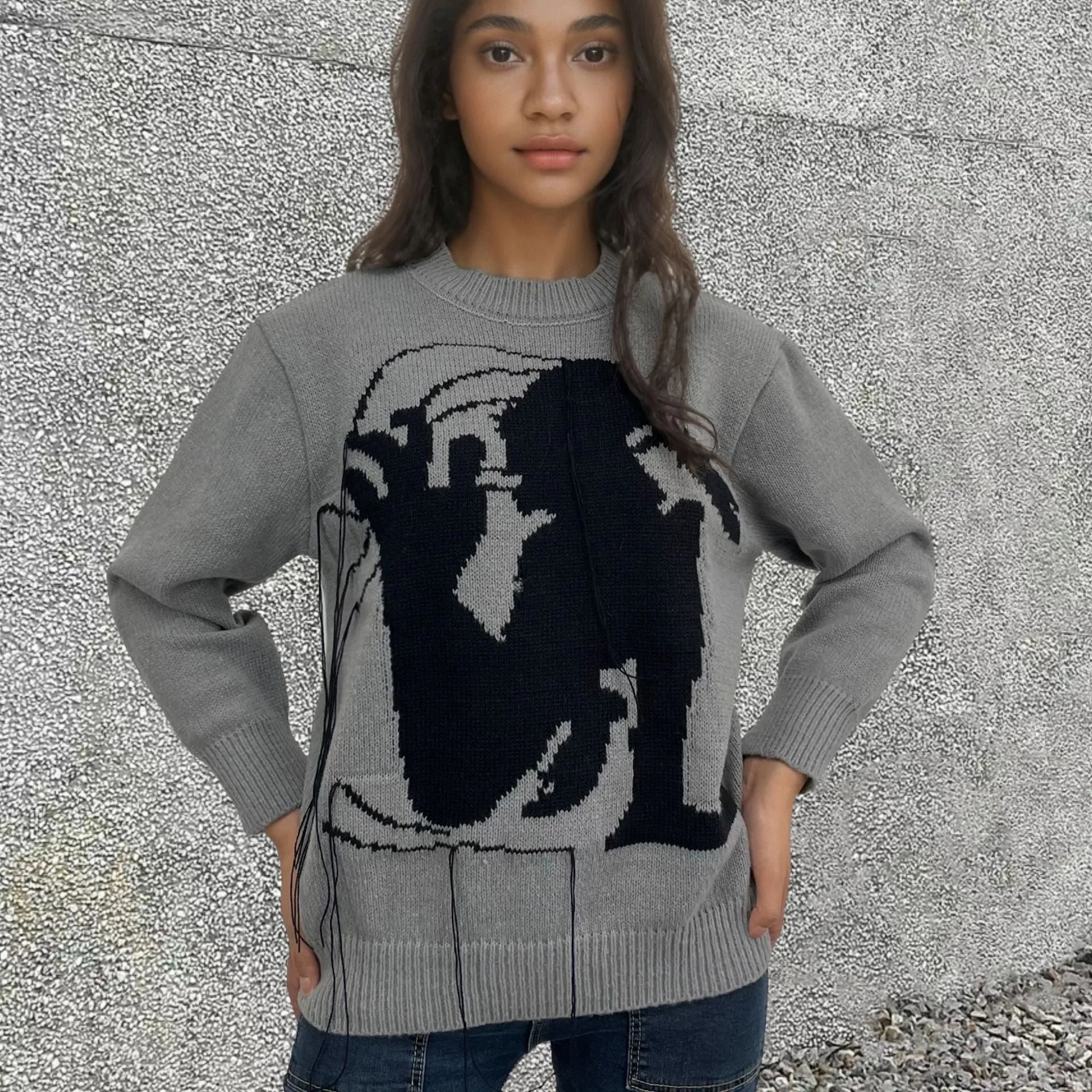 Women's grey alpaca wool sweater with tassel detailing and loose fit
