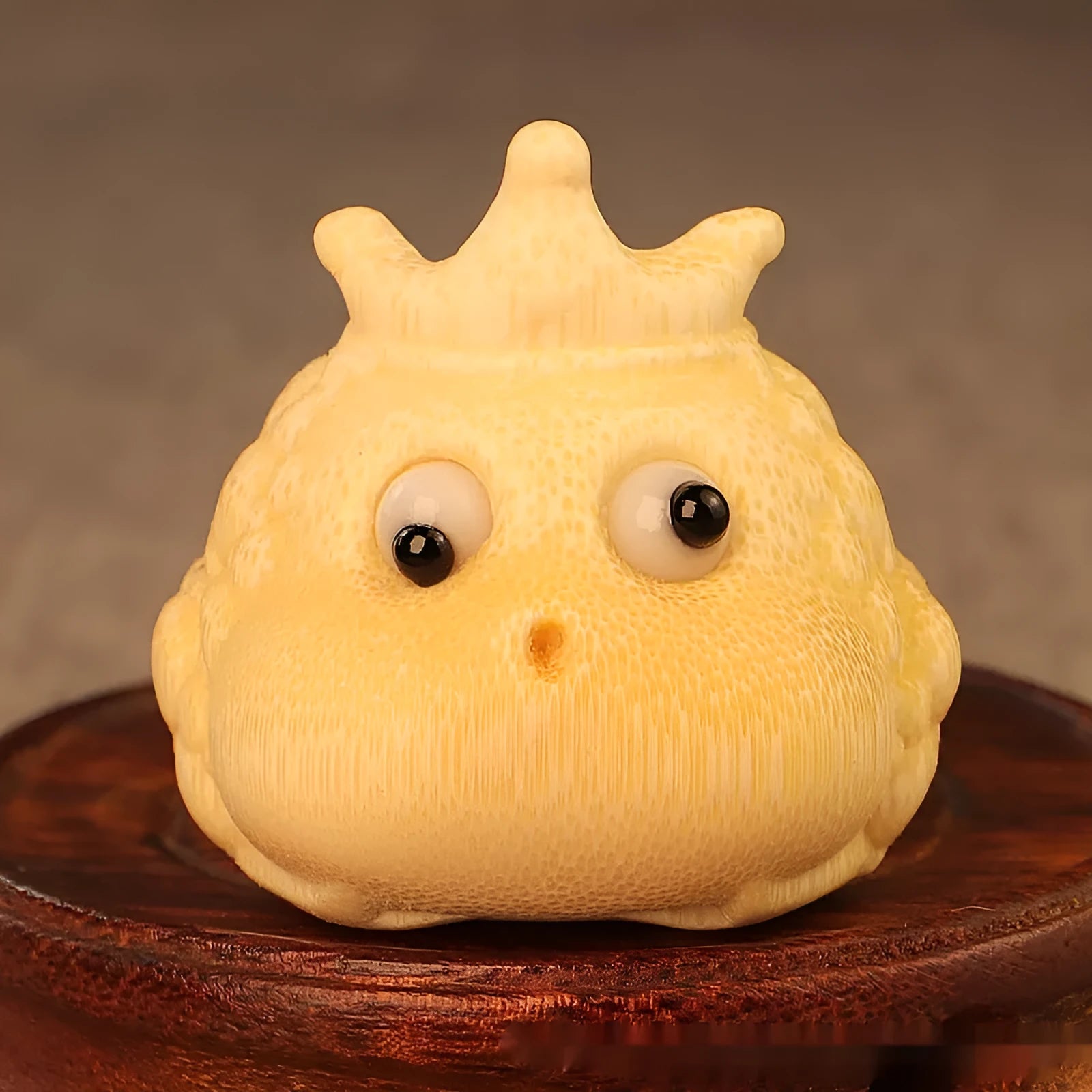 Hand-carved bamboo ornament of a cute Crown Princess toad with live eye detail