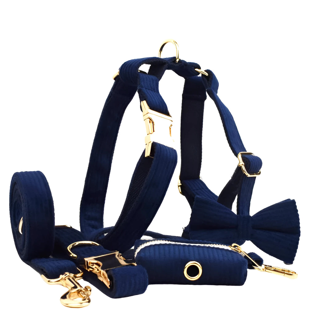 Navy blue corduroy dog collar leash set with bow, vest, and poop bag on white background