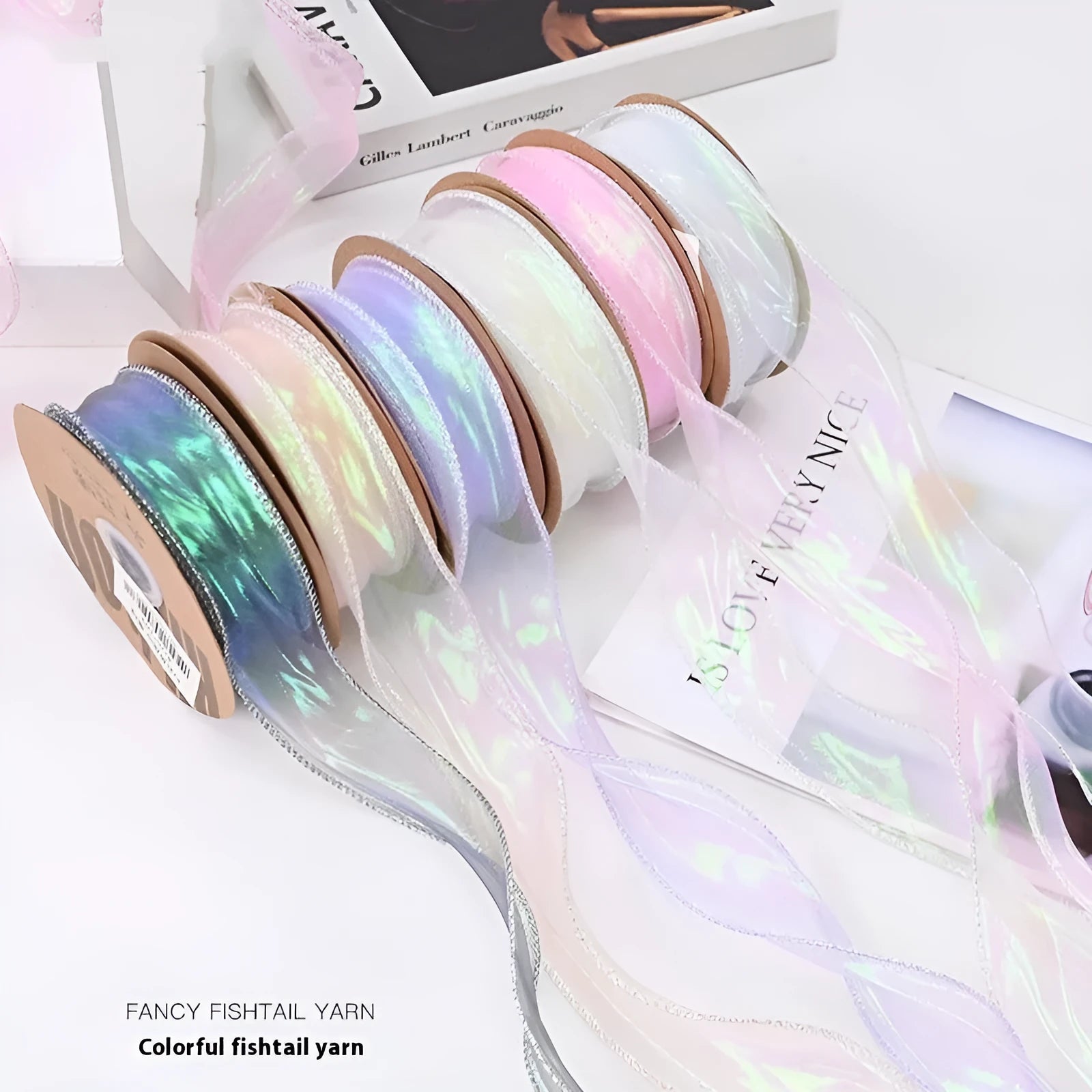 Roll of 4cm wide fishtail yarn mesh ribbon in illusion colour options for floral and gift decoration