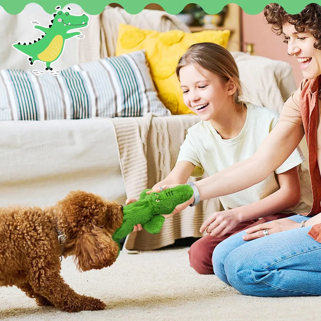 Green crocodile-shaped squeaky dog toy with crinkle paper tail for aggressive chewers