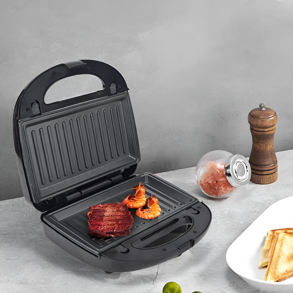 Black electric sandwich maker with six non-stick pans and a brushed stainless steel top cover.