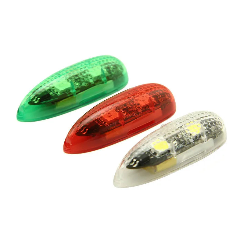 Three compact V3 wireless charging navigation lights with adhesive backing, shown in red, green, and white.