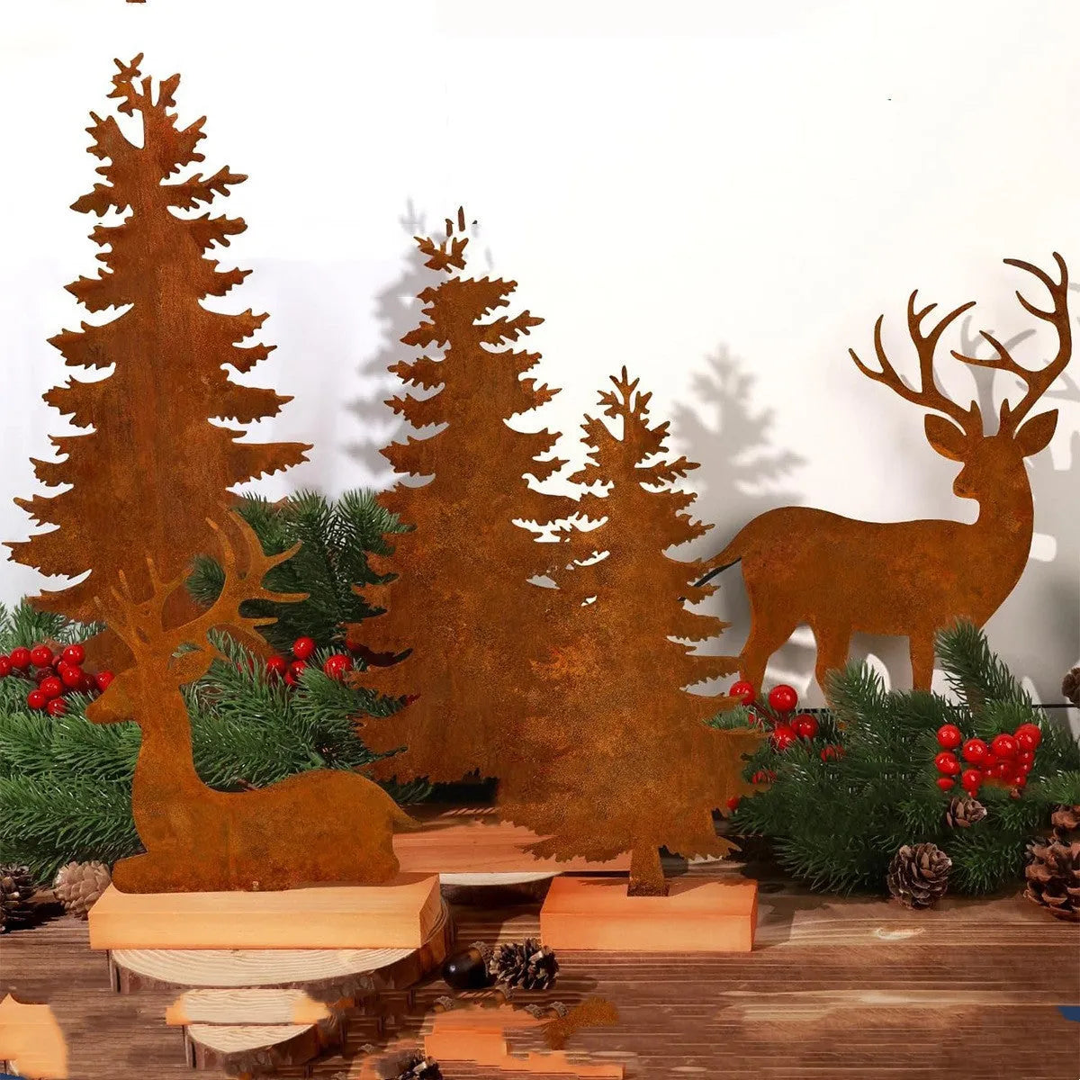 Set of three rustic metal Christmas tree elk ornaments with distressed iron finish.