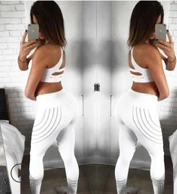 Woman wearing black glow-in-the-dark printed milk silk workout leggings for fitness.