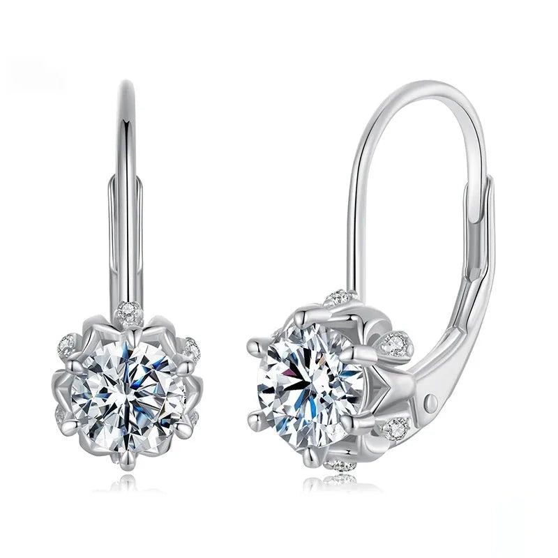 Silver flower bud shaped clip-on earrings with a white gold plated finish and a central moissanite stone.