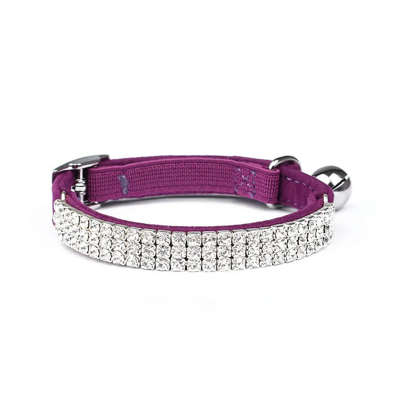 A velvet suede cat collar with rhinestone decoration, shown in an adjustable length from 20 to 30 cm.