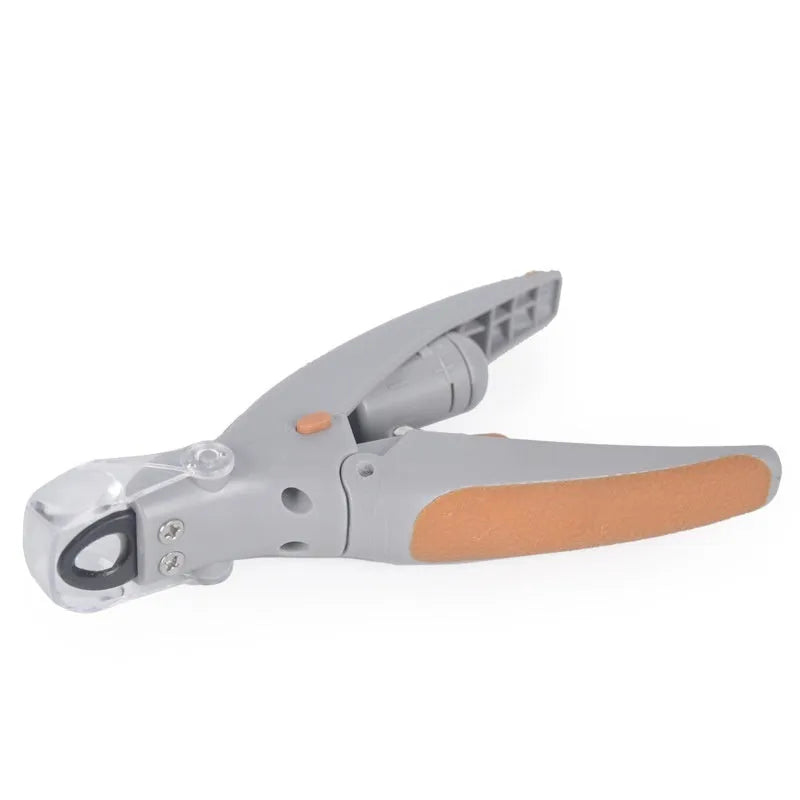 White battery-powered dog nail trimmer with built-in light and blood line guide on a blister card.