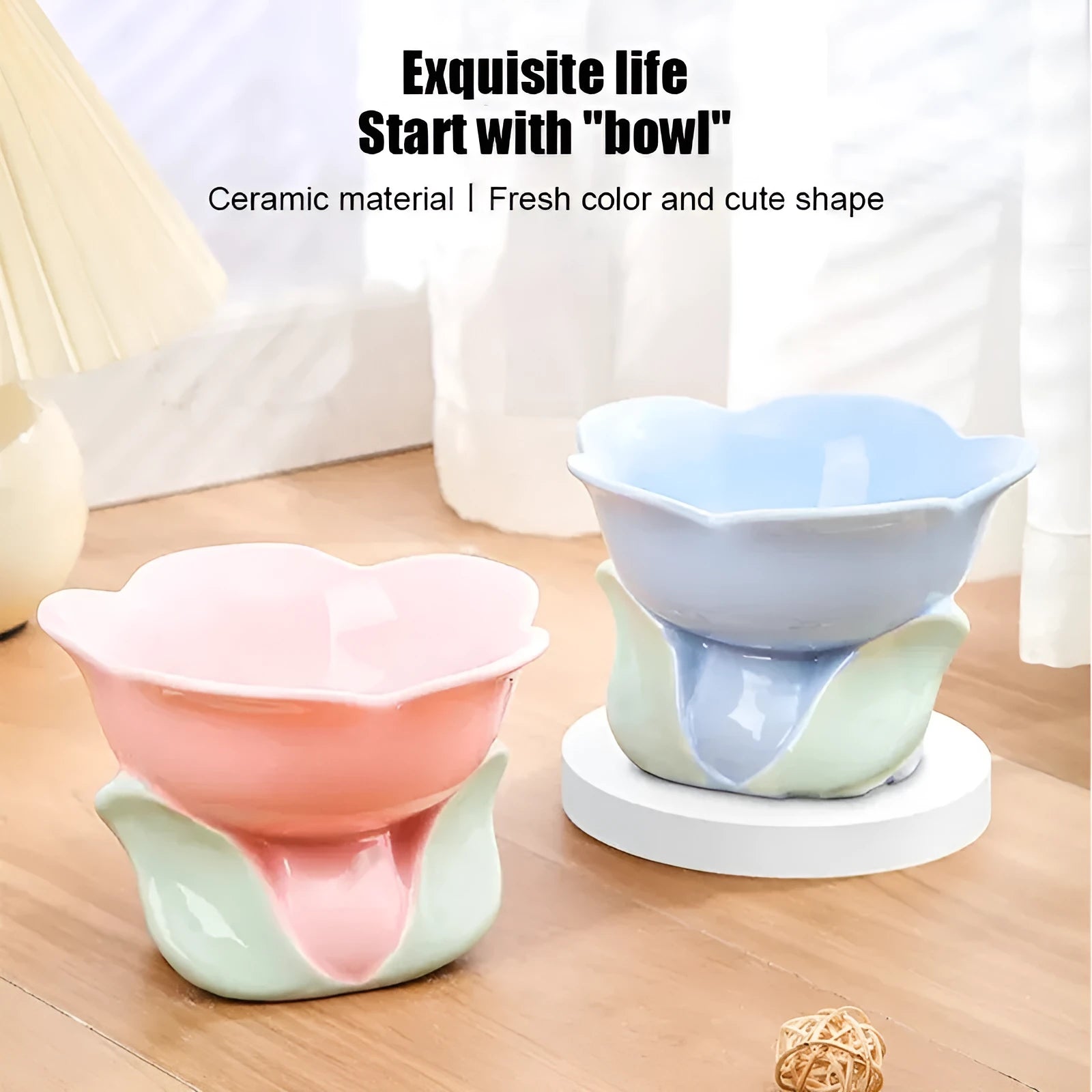 Blue floral patterned ceramic raised pet bowl for cats and dogs on a wooden floor.