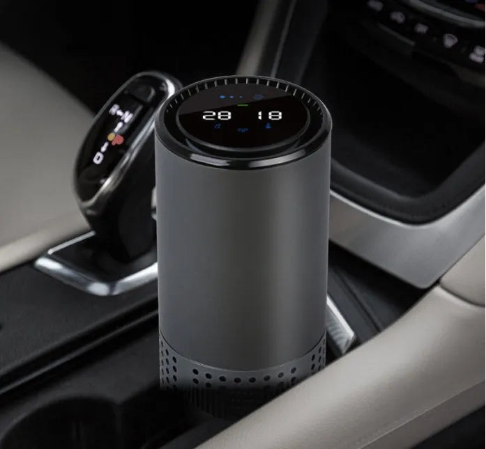 Aluminium alloy car air purifier with USB cable, negative ion generator, and air quality display.