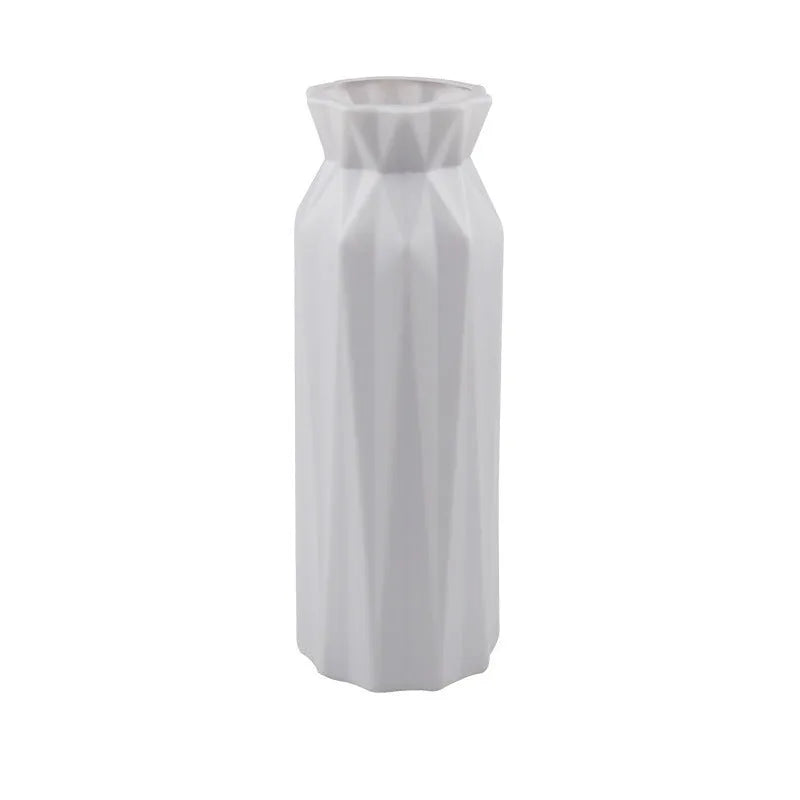Green melamine plastic vase with 7.2cm base on a wooden table.