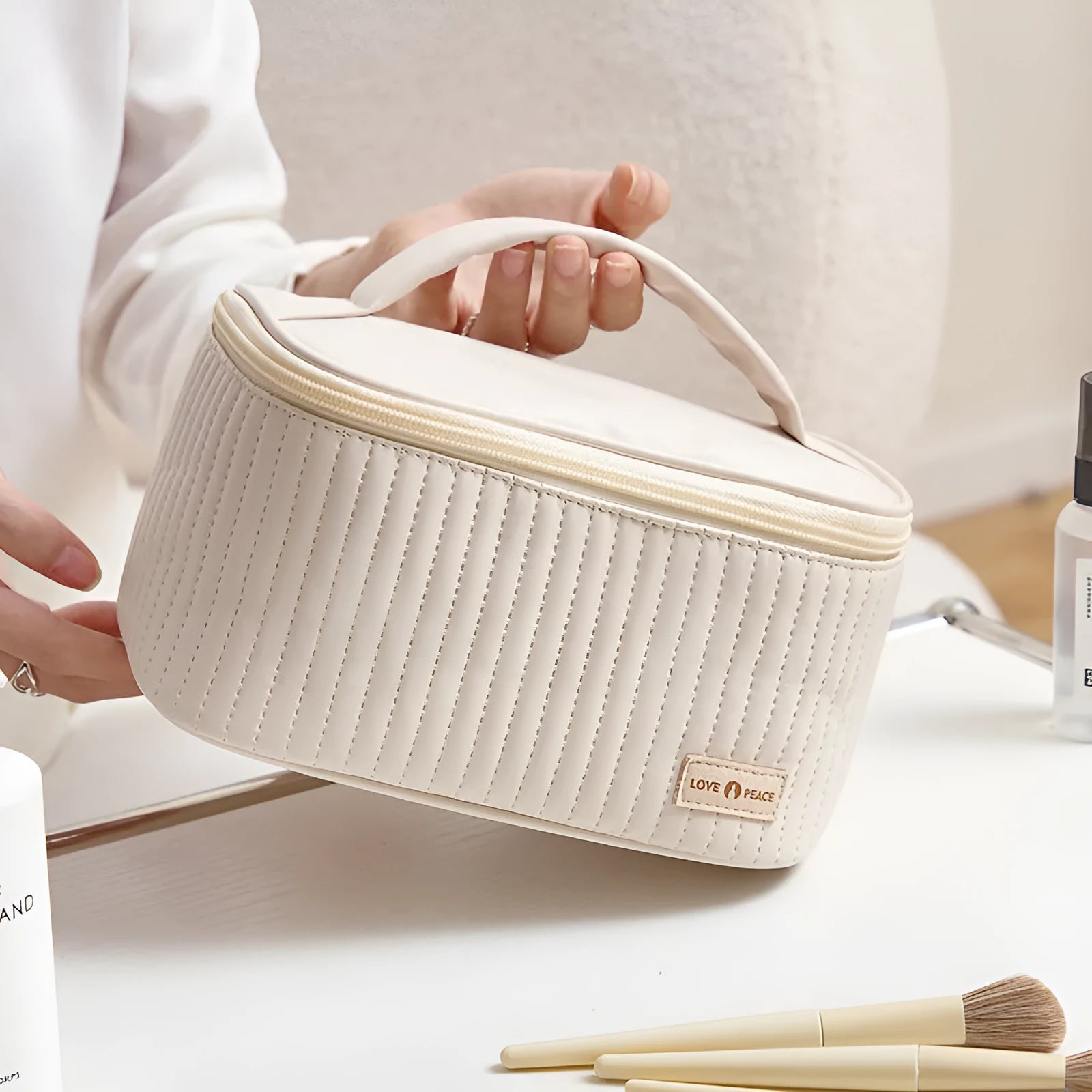 Open-top cake-shaped makeup bag in PU leather, shown in one of six available colours.