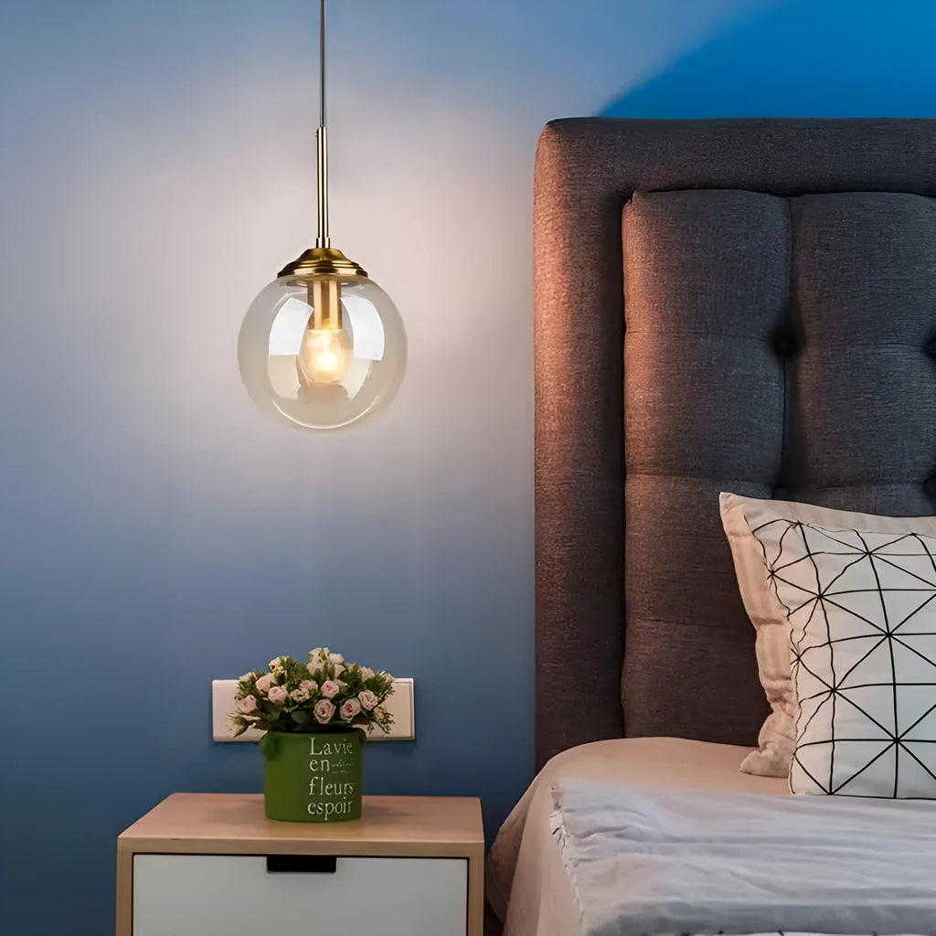 Modern Nordic style ceiling chandelier with spherical glass shades in clear, amber and grey.