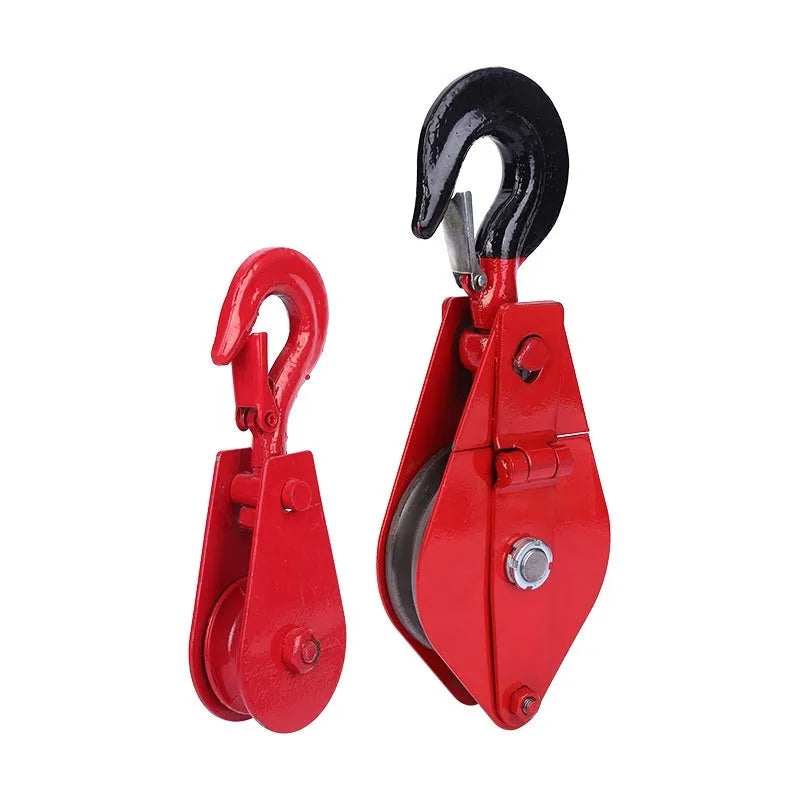 Red industrial steel lifting pulley with a forged ring hook and safety latch for wire rope.