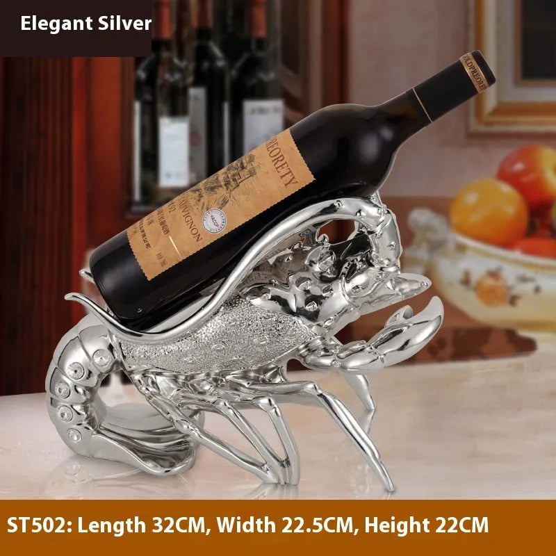 Lobster-shaped natural resin wine rack ornament in rose gold or silver colour on a table.