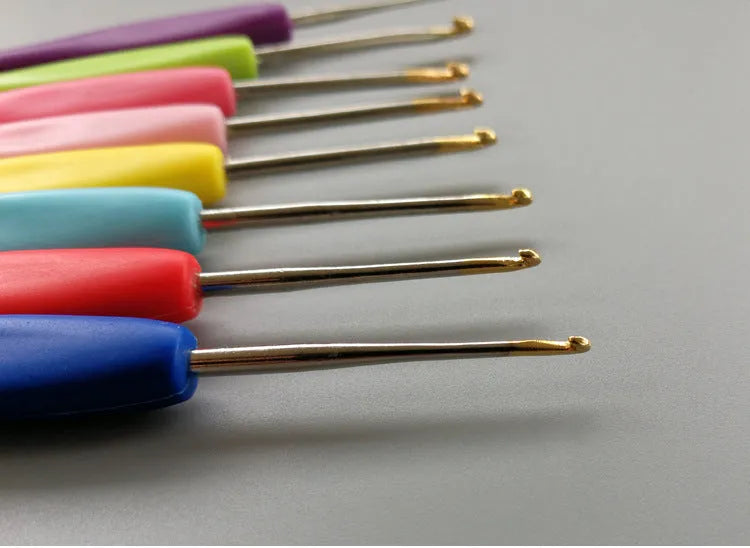 Complete set of 16 crochet hooks with soft and hard handles in a grey PU zippered bag.