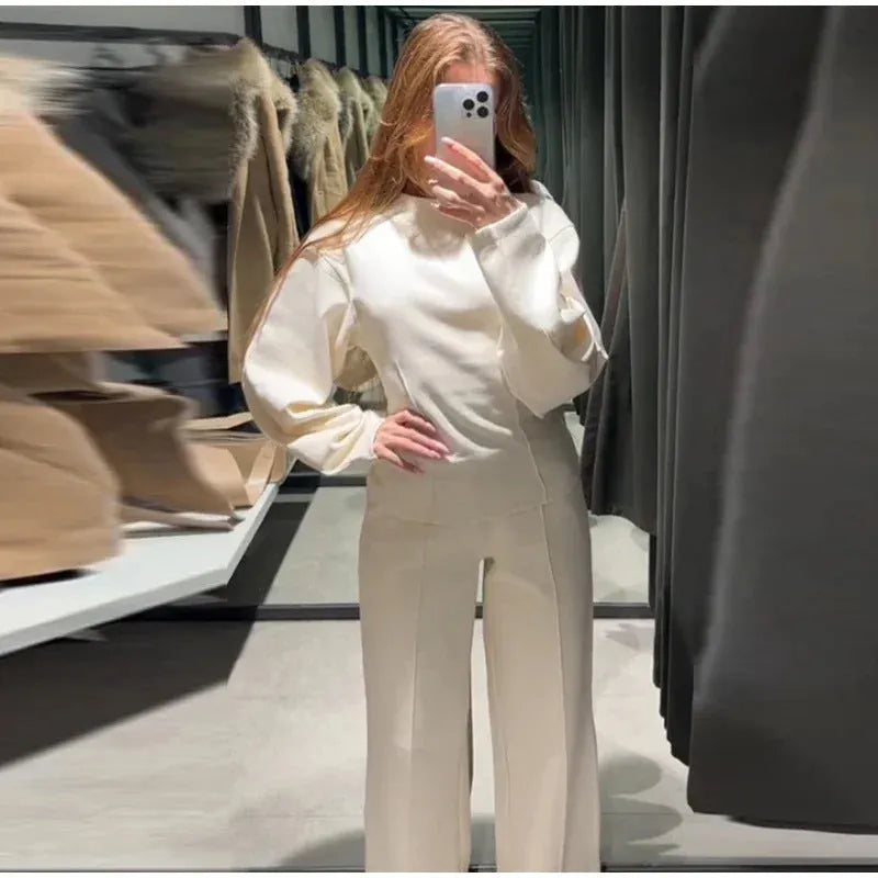 Women's polar fleece suit set showing O-neck pleated top with long sleeves and matching wide leg trousers