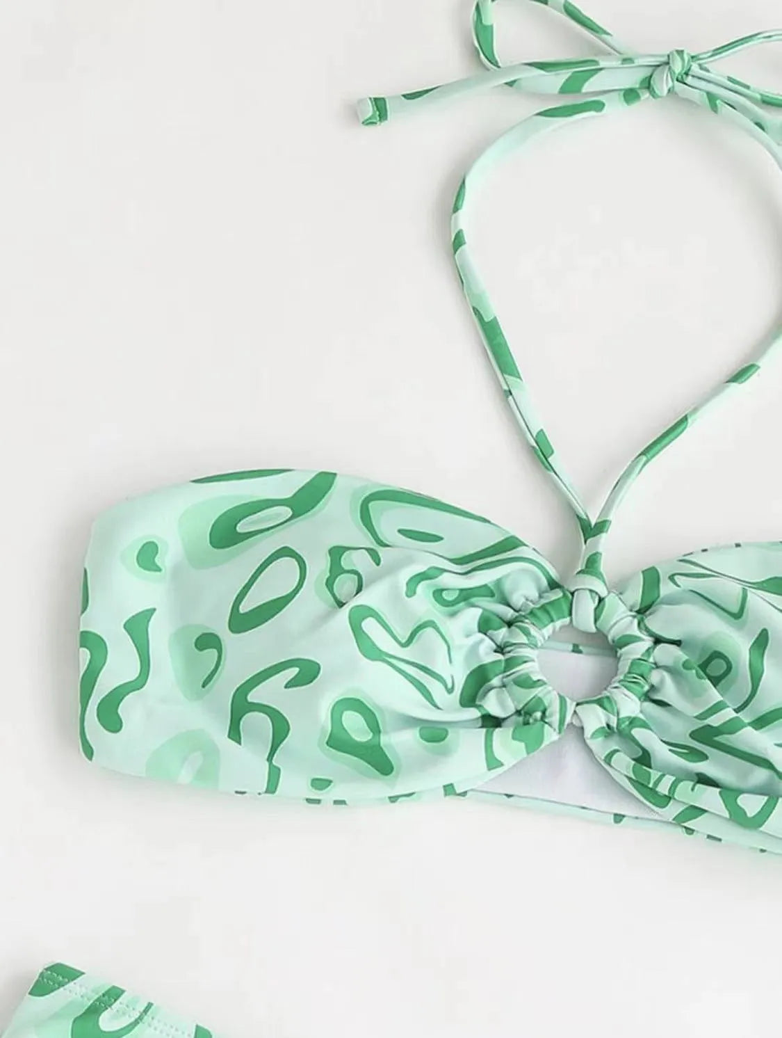Women's blue floral bandeau bikini with split swimsuit design showing front and back views