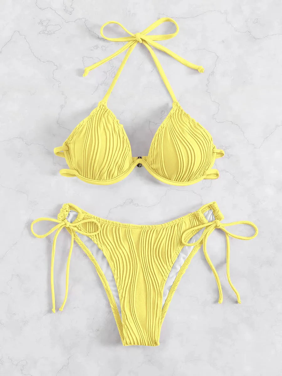 Women's apricot coloured split bikini swimsuit with steel bracket underwire on a mannequin.