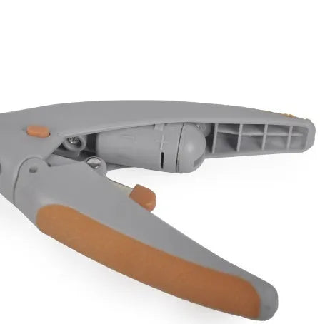 White battery-powered dog nail trimmer with built-in light and blood line guide on a blister card.