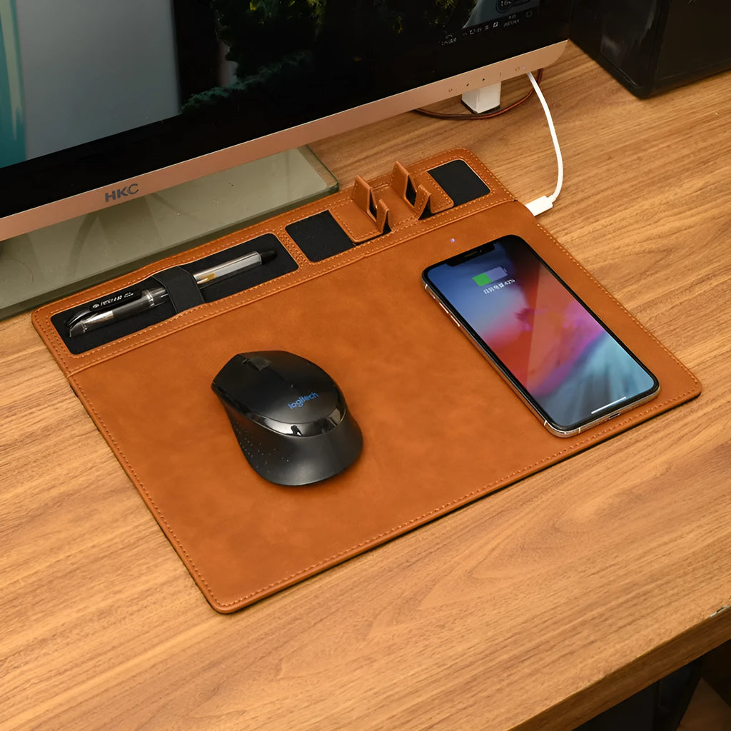 Pink wireless charging mouse pad with integrated phone holder on a desk