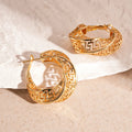Women's geometric hollow stud earrings with twisted round design in silver or gold electroplated finish