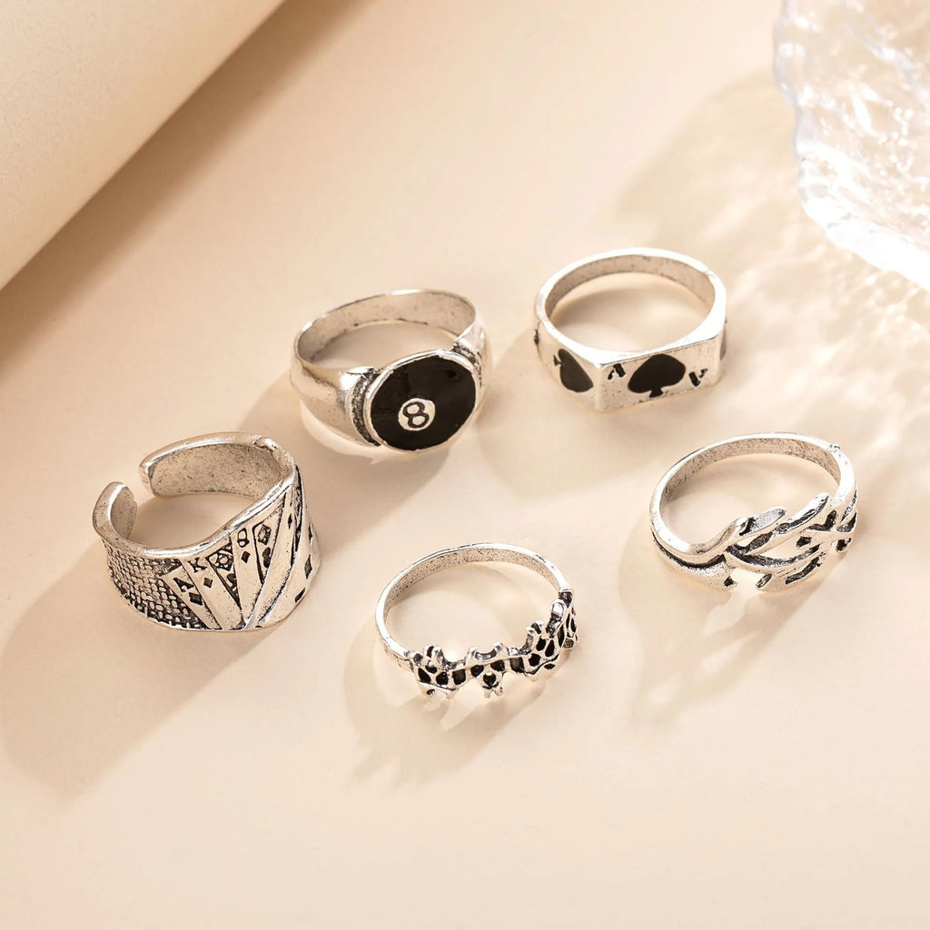 Black alloy women's ring with a detailed retro spade card design on its face.