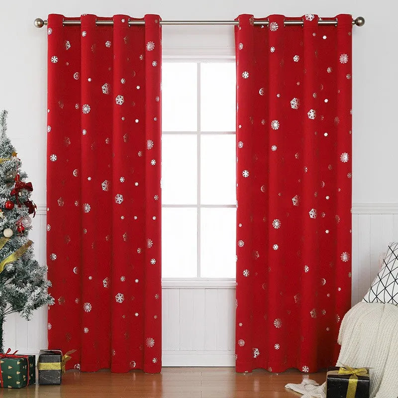 Red snowflake pattern shade cloth curtain with lace loop detailing hung on window